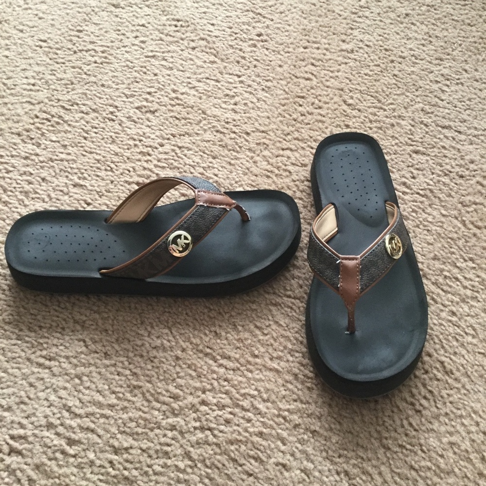 Michael Kors brown flip flops size 7
